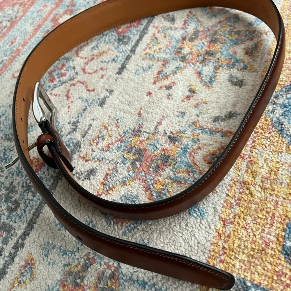 Beautiful brown belt with silver buckle. New, never worn.